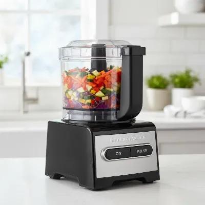 Hamilton Beach Stack & Snap 12-Cup Food Processor on a kitchen countertop, with vegetables in the bowl, vibrant and well-lit.
